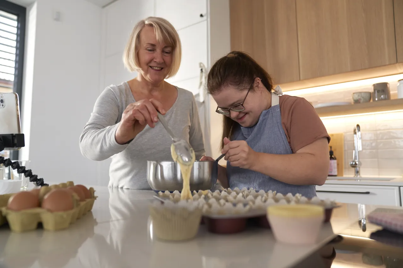 Two women baking together in a home kitchen